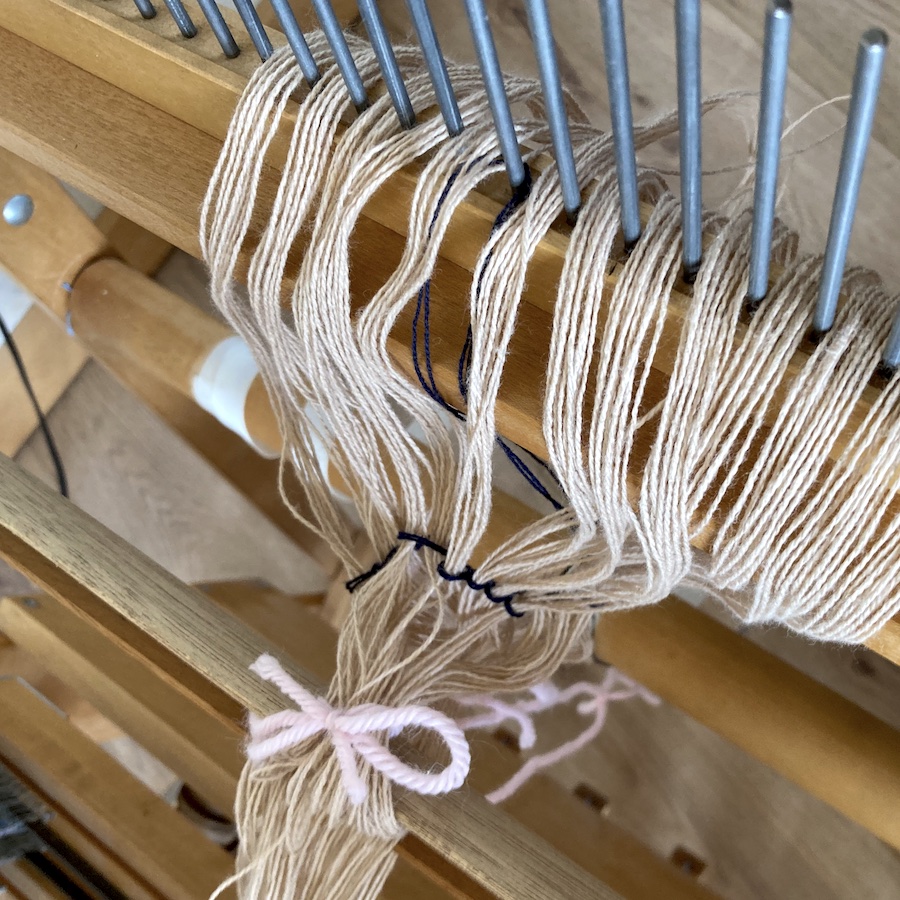 Close up of loom warp fibers being dressed