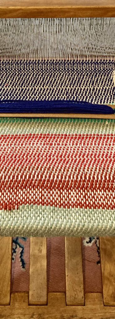 A floor loom showing weaving detail